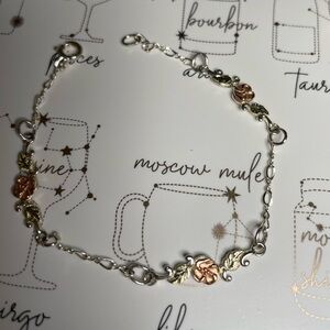 Landrom's black hills solid gold and sterling silver chain rose station bracelet